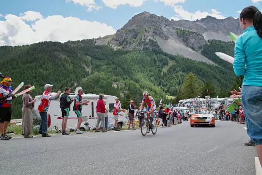 Tour de France 2011 driveway to Col d'Izoard "Brunisard, France - June 19, 2011:Tour de France 2011 driveway to Col d'Izoard near Brunisard in France in the Alps. A lot of people are looking to the famous bicycle race in France" tour de france stock pictures, royalty-free photos & images