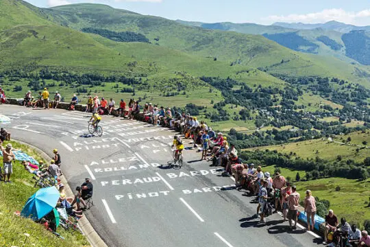 Road of Le Tour de France Col de Peyresourde,France- July 23, 2014: Image of amateur cyclists climbing the road to Col de Peyresourde, before the apparition of the peloton in the stage 17 of Le Tour de France on 23 July 2014. tour de france stock pictures, royalty-free photos & images